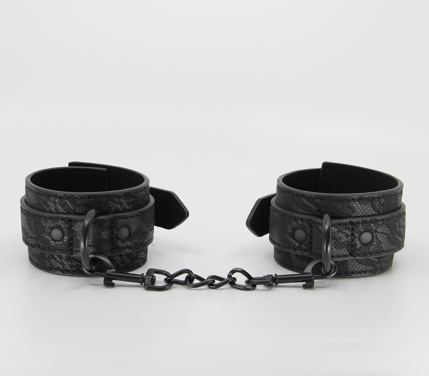 Love In Leather Black Lace Printed Wrist Restraints With Matte Black Hardware And Chain Join