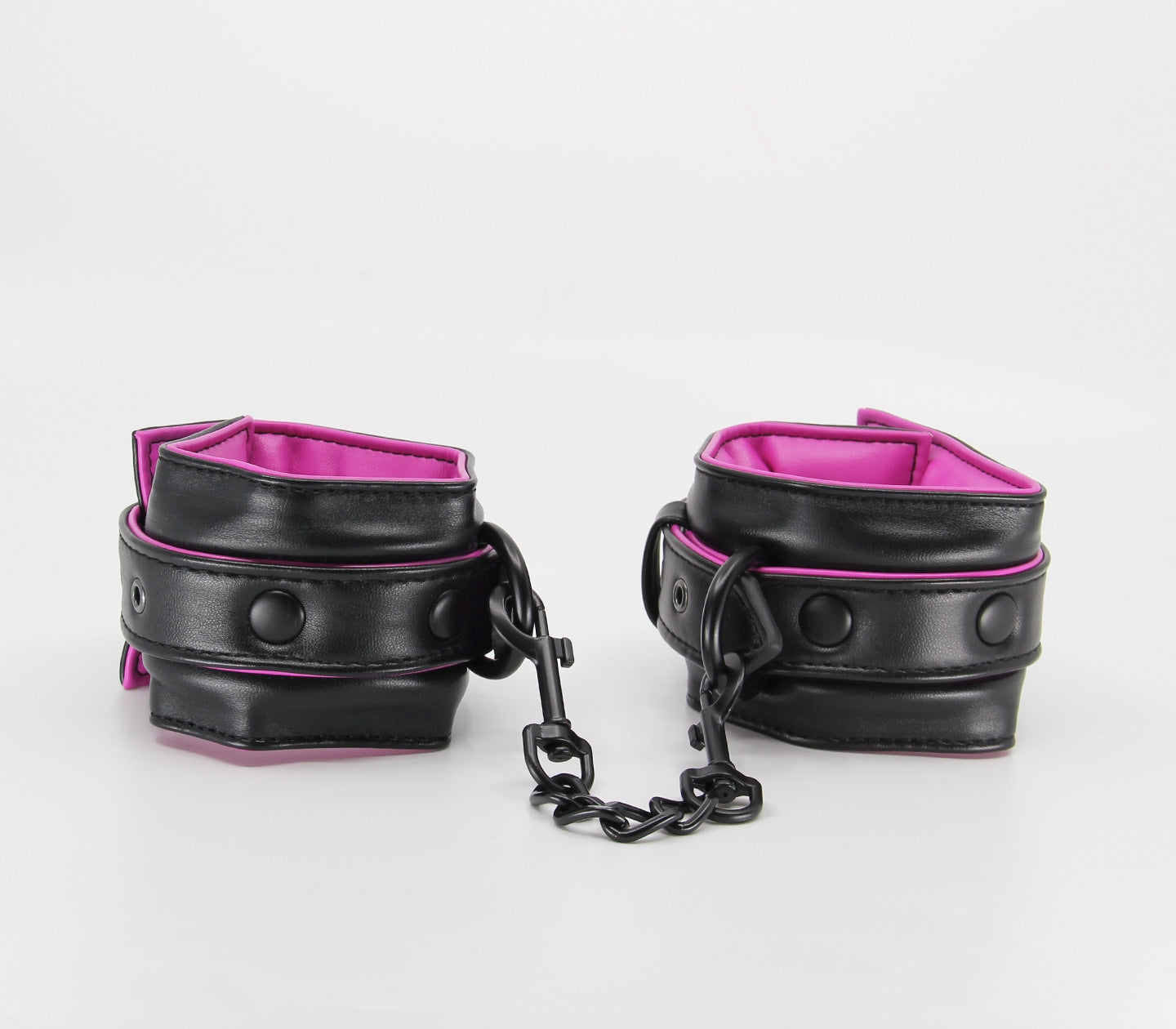 Love In Leather Black Padded Wrist Restraints With Contrast Hot Pink Lining, Matte Black Hardware