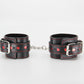 Love In Leather Black Faux Leather Wrist Cuffs With Red Metallic Heart