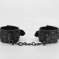 Love In Leather Black Lace Printed Wrist Restraints With Matte Black Hardware And Chain Join